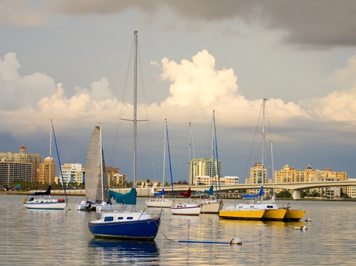 Sail boats in a river.